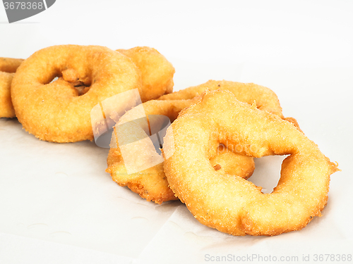 Image of Closeup of doughnuts in pile on baking paper