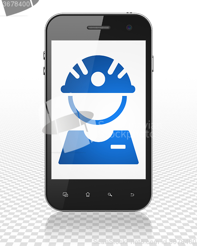 Image of Industry concept: Smartphone with Factory Worker on display