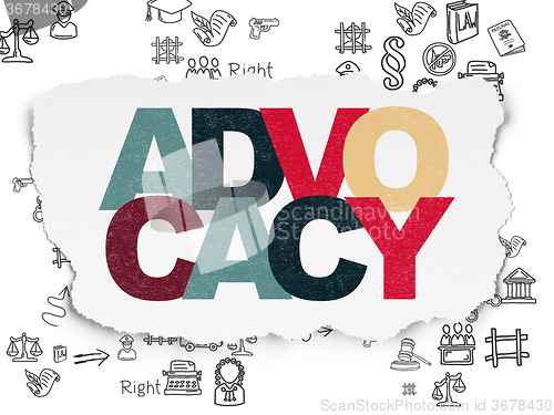 Image of Law concept: Advocacy on Torn Paper background