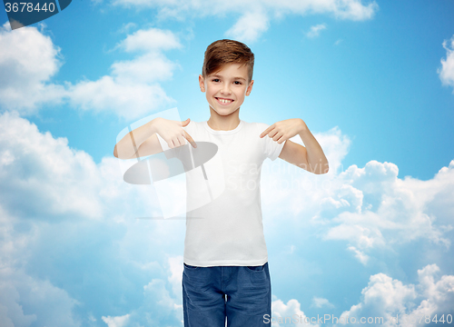 Image of happy boy pointing finger to his white t-shirt