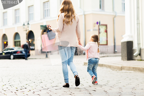 Image of close up of mother and child shopping in city