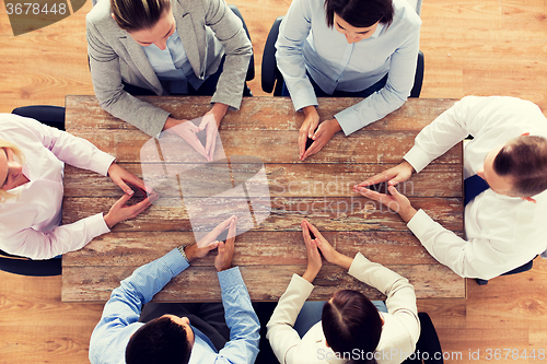 Image of close up of business team sitting at table