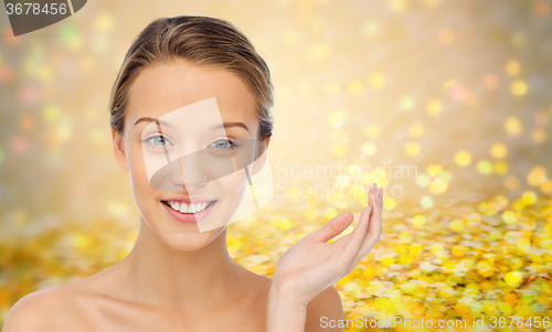 Image of smiling young woman face and shoulders