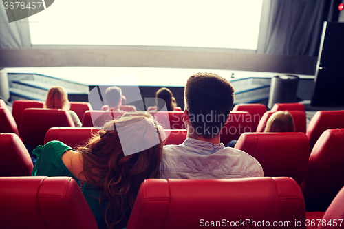 Image of happy couple watching movie in theater or cinema