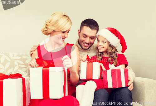 Image of happy family opening gift boxes