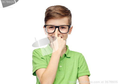 Image of happy boy in green polo t-shirt and eyeglasses