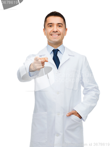 Image of smiling male doctor in white coat pointing at you