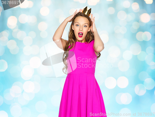 Image of happy young woman or teen girl in pink dress