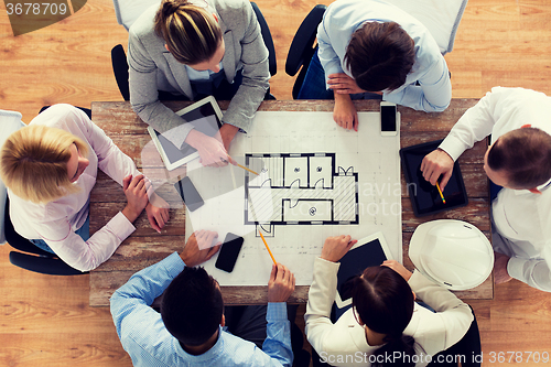 Image of close up of business team sitting at table