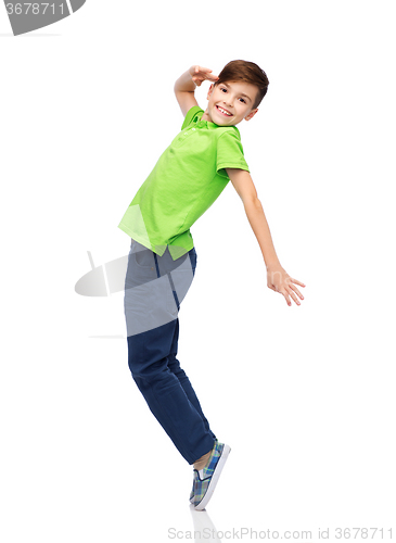 Image of smiling boy having fun or dancing