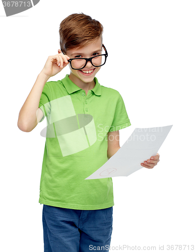 Image of happy boy in eyeglasses holding school test result