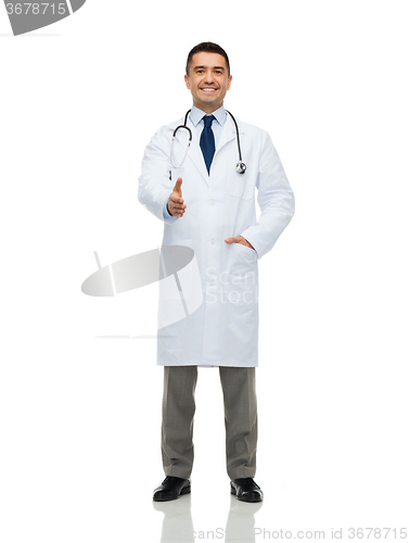 Image of smiling doctor in white coat making handshake