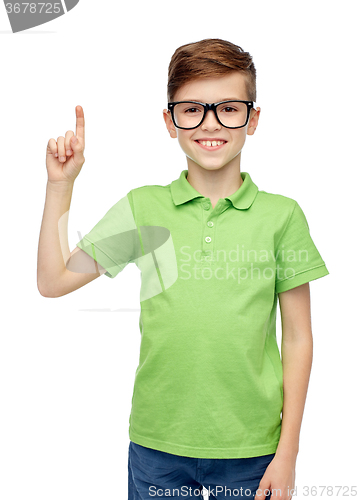 Image of happy boy in eyeglasses pointing finger up