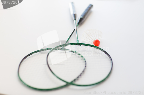 Image of close up of badminton rackets with shuttlecock