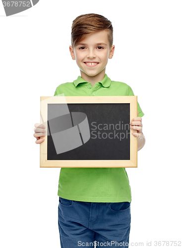 Image of happy boy in t-shirt holding blank chalk board