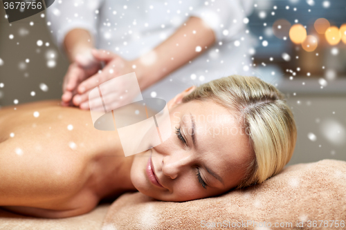 Image of close up of woman having back massage in spa
