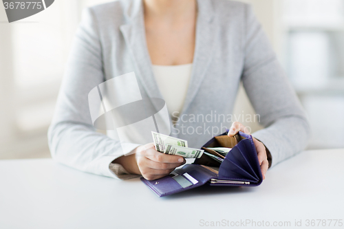 Image of close up of woman hands with wallet and money