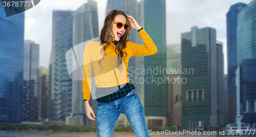 Image of happy young woman or teen girl over city