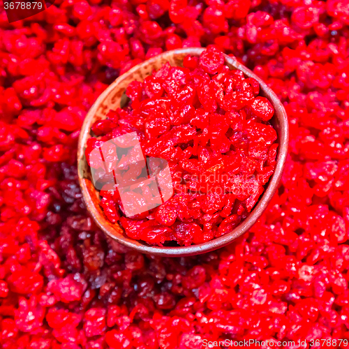 Image of Scoop of dry cranberries.