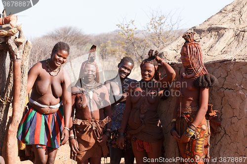 Image of Himba and zemba woman with ornaments on the neck in the village