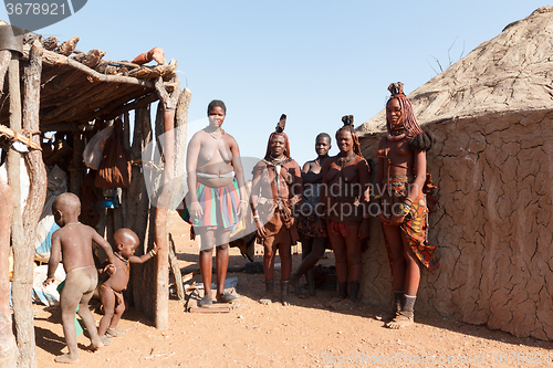 Image of Himba and zemba woman with ornaments on the neck in the village