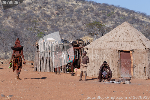 Image of Himba and zemba woman with ornaments on the neck in the village