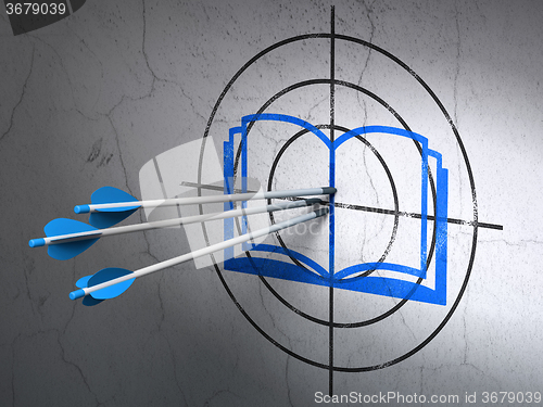 Image of Studying concept: arrows in Book target on wall background