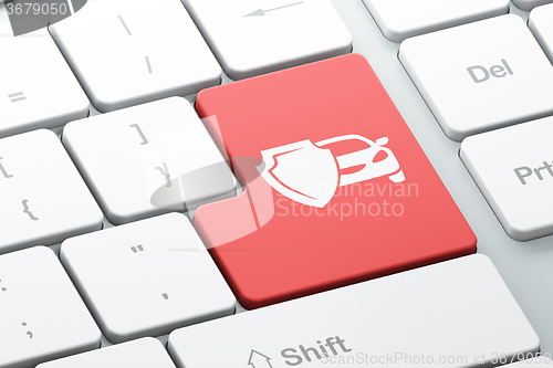 Image of Insurance concept: Car And Shield on computer keyboard background