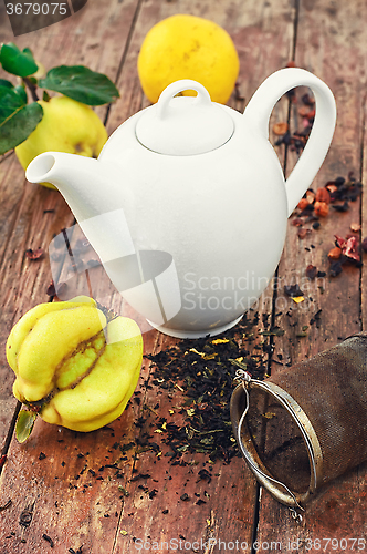 Image of White teapot and fruit