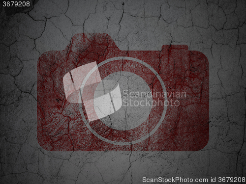 Image of Travel concept: Photo Camera on grunge wall background
