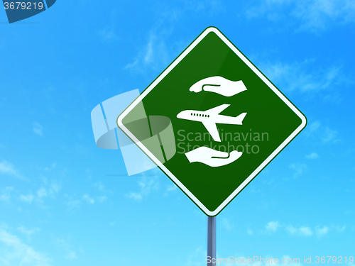 Image of Insurance concept: Airplane And Palm on road sign background