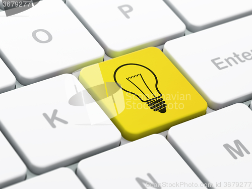 Image of Finance concept: Light Bulb on computer keyboard background