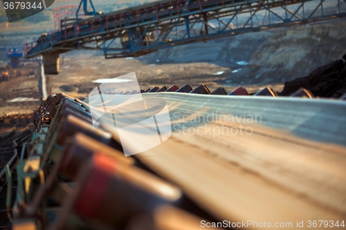 Image of Long conveyor belt transporting ore