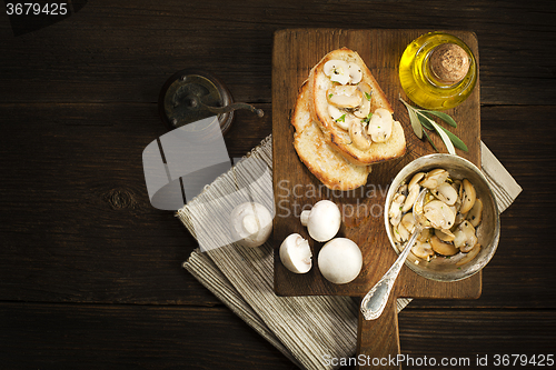 Image of Appetizer with mushroom and bread.