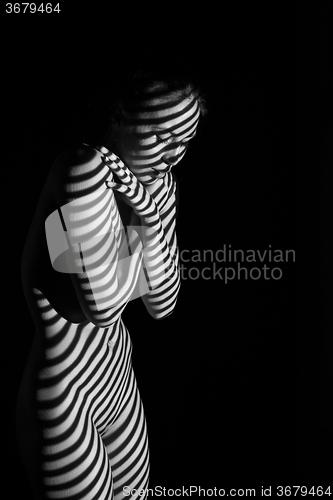 Image of The  body of woman with black and white zebra stripes