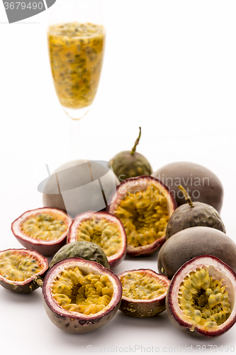 Image of Passion Fruit Flesh In Its Rind And In A Glass