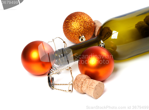Image of Empty bottle of wine, corks, muselets and Christmas decorations