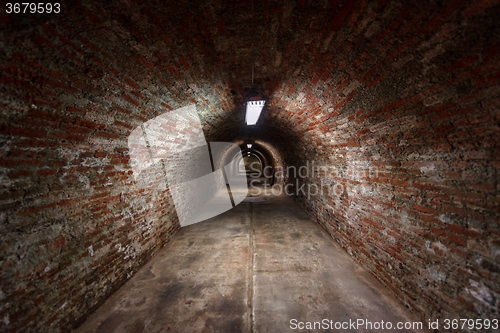 Image of Long underground brick tunnel angle shot