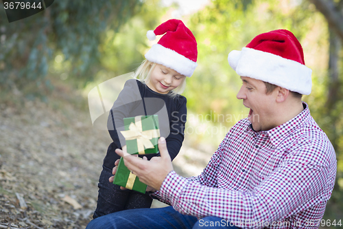 Image of Father Giving Young Daughter Christmas Gift