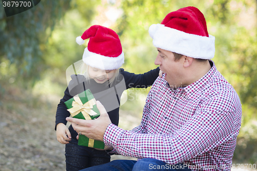 Image of Father Giving Young Daughter Christmas Gift