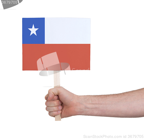 Image of Hand holding small card - Flag of Chile