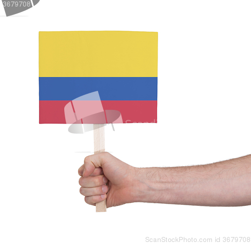 Image of Hand holding small card - Flag of Colombia