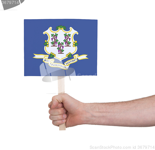 Image of Hand holding small card - Flag of Connecticut