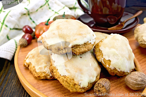 Image of Cookies pumpkin with cup and spices on tray