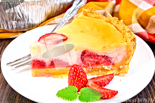 Image of Pie strawberry with sour cream in dish on dark board