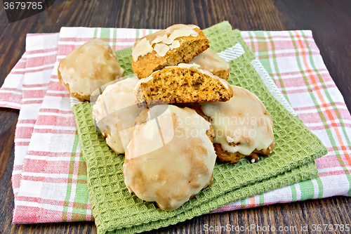 Image of Cookies pumpkin on kitchen towel and board