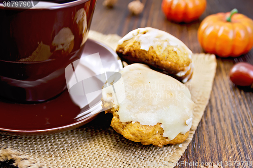 Image of Cookies pumpkin with cup on sacking