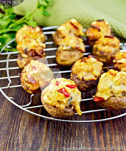 Image of Champignons stuffed meat on lattice with napkin