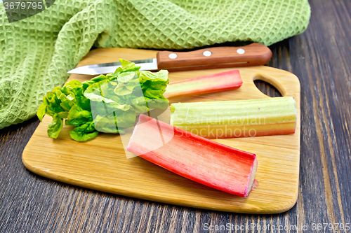 Image of Rhubarb with knife and napkin on board