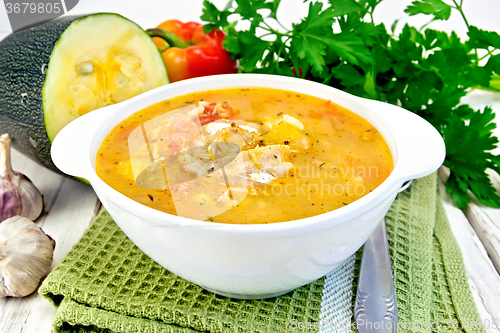 Image of Soup fish with zucchini and peppers on board